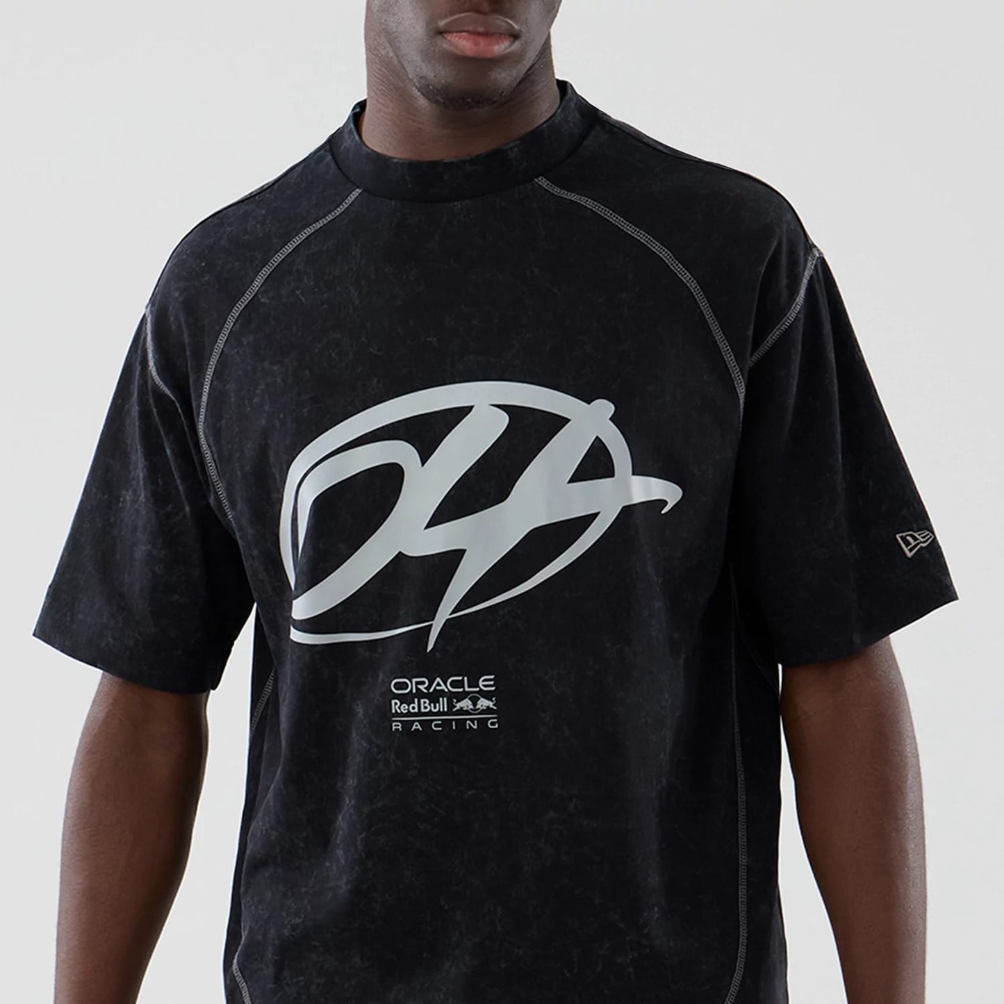 The model is wearing this Red Bull Racing Drop Shoulder T-Shirt in black. 3