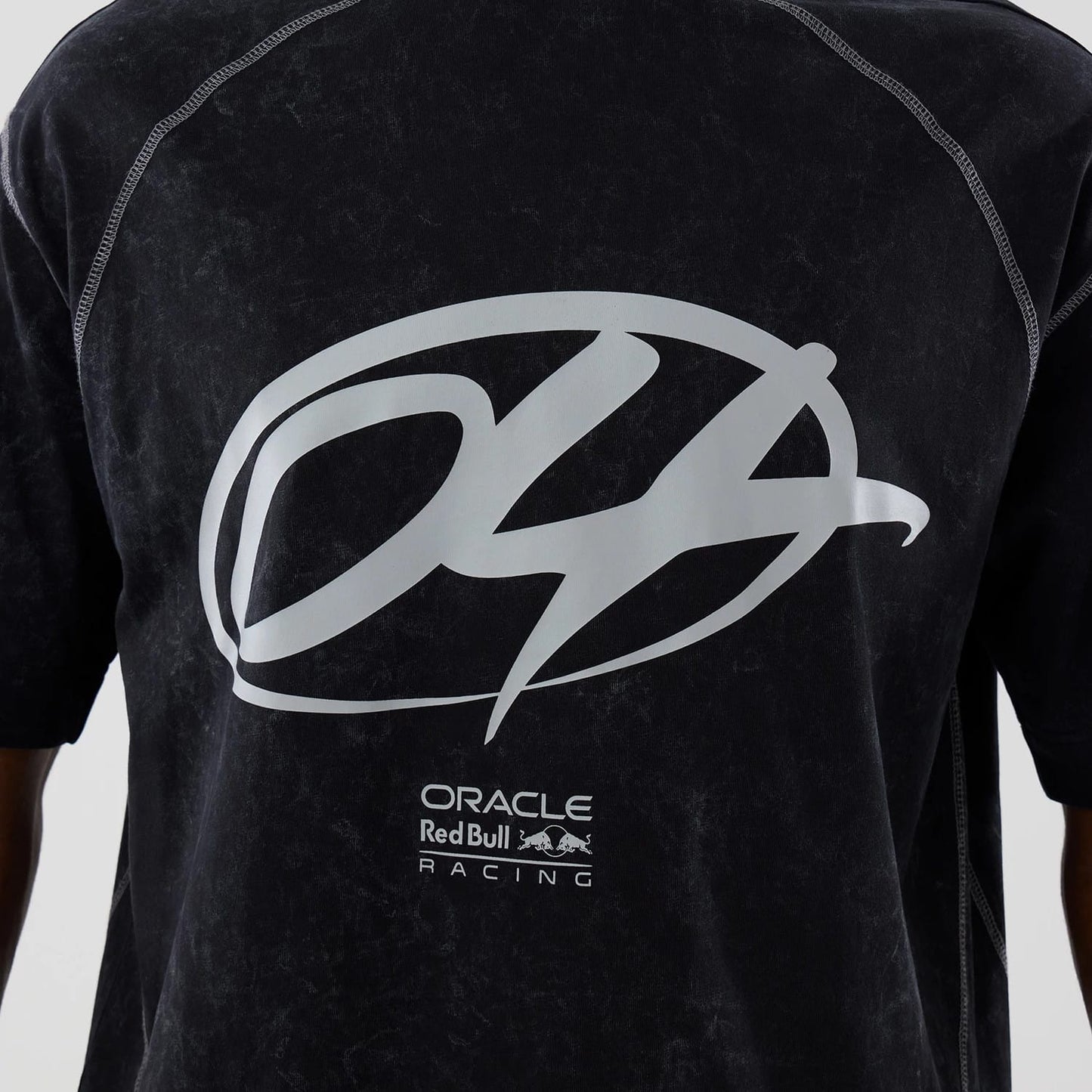 The model is wearing this Red Bull Racing Drop Shoulder T-Shirt in black. 4