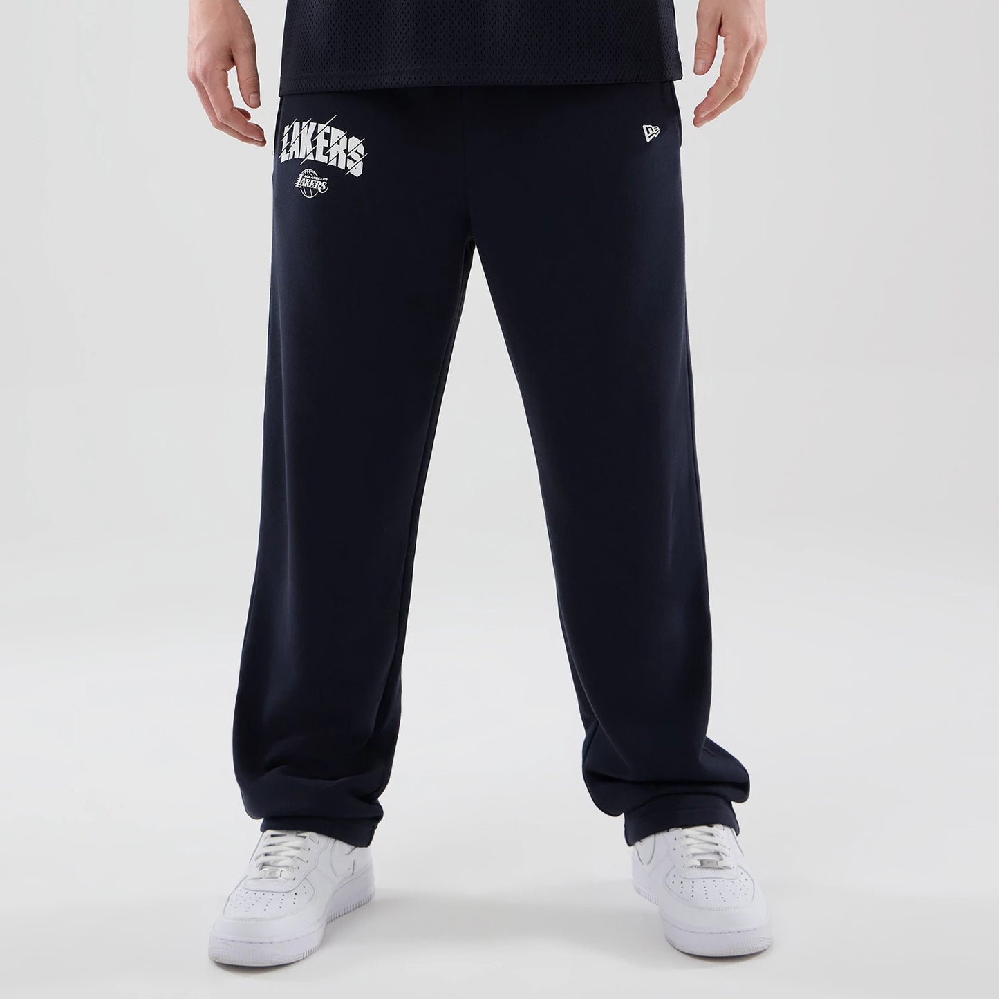 The model is wearing these NBA Core Plus LA Lakers Straight Leg Joggers in navy. 1