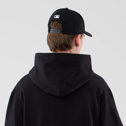The model is wearing this New Era Open Hem Pullover Hoodie in black. 6