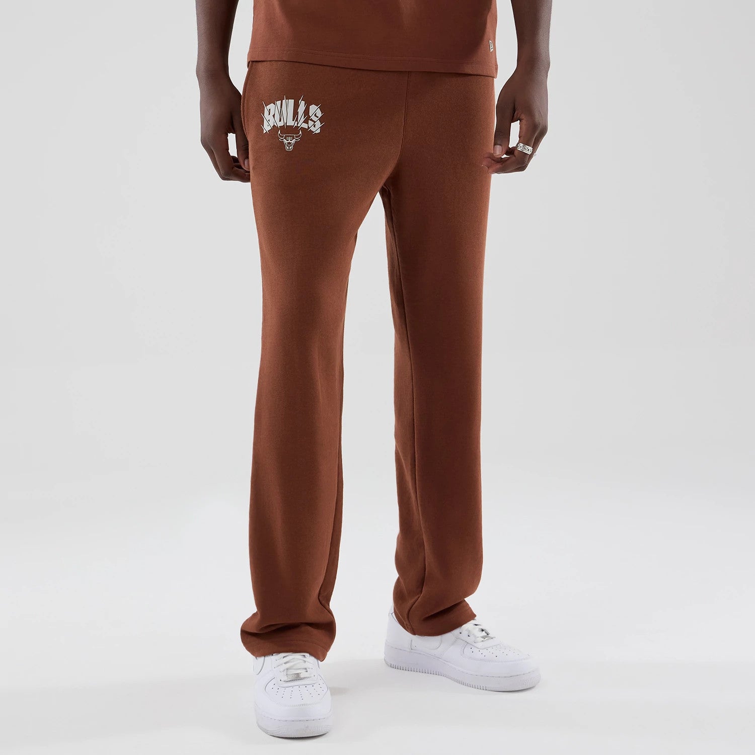 The model is wearing these NBA Core Plus Chicago Bulls Straight Leg Joggers in brown. 3