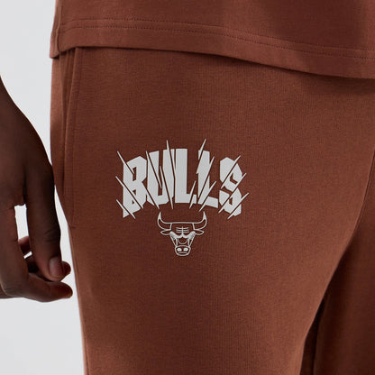 The model is wearing these NBA Core Plus Chicago Bulls Straight Leg Joggers in brown. 4