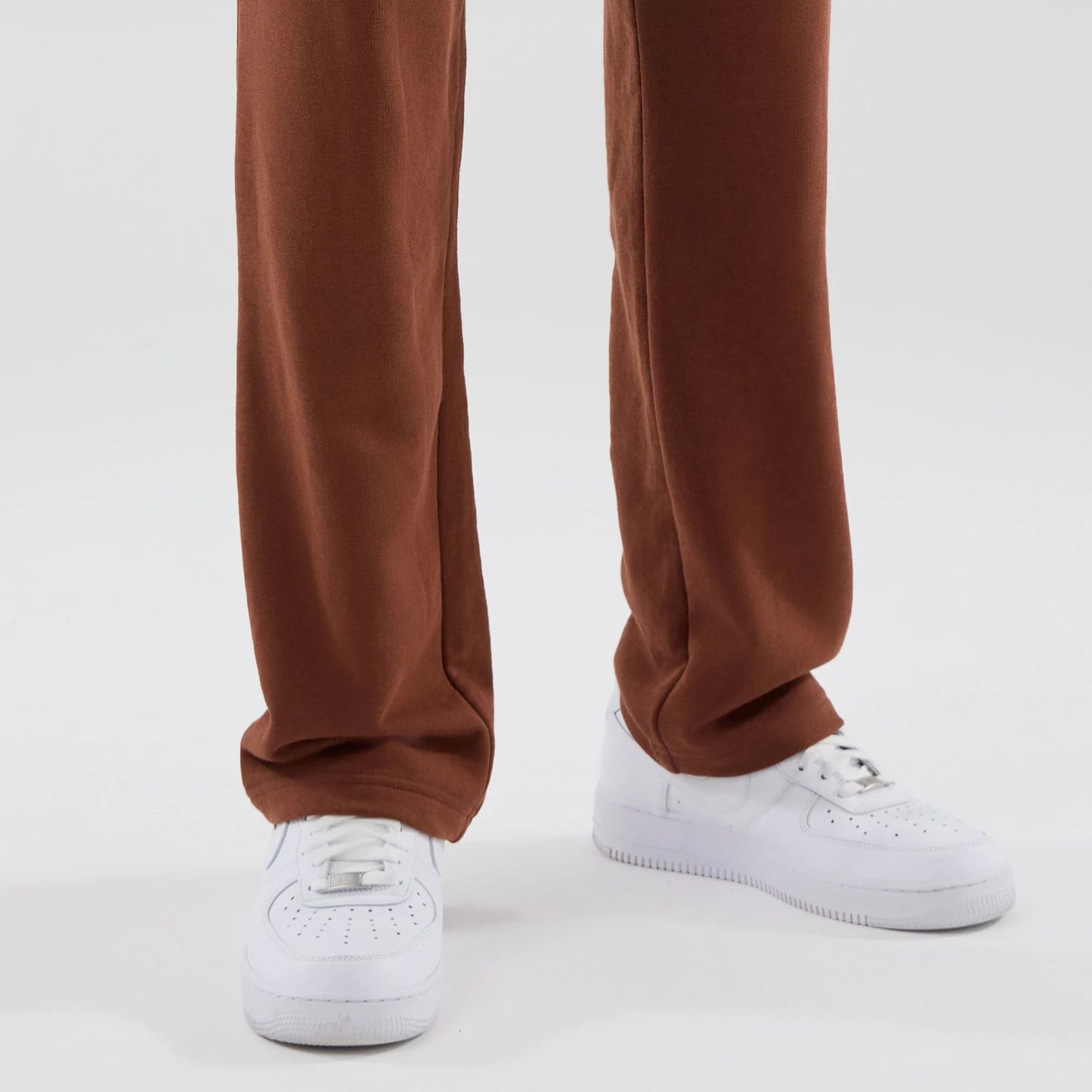 The model is wearing these NBA Core Plus Chicago Bulls Straight Leg Joggers in brown. 6