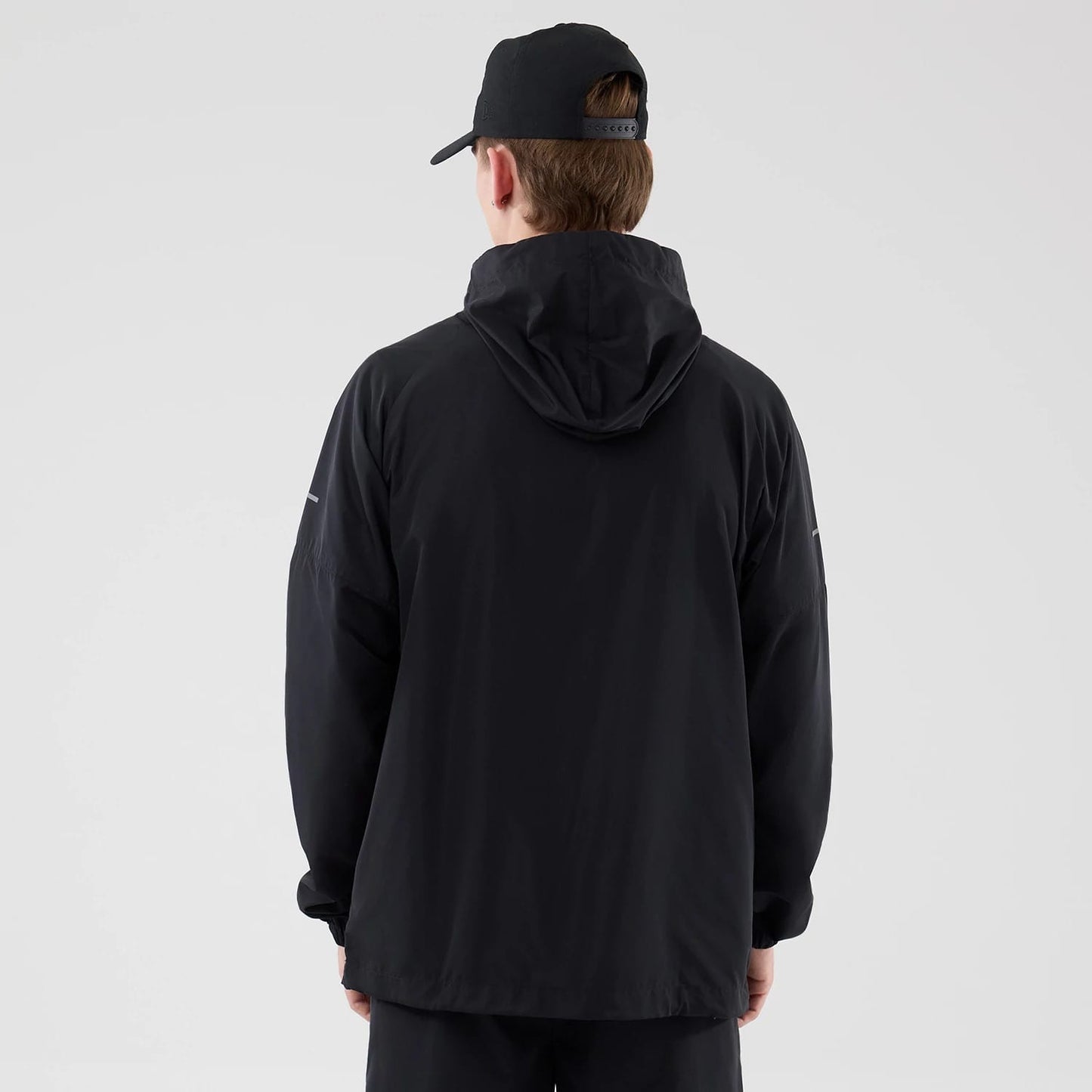The model is wearing this MLB Core Plus Windbreaker New York Yankees Jacket in black. 2