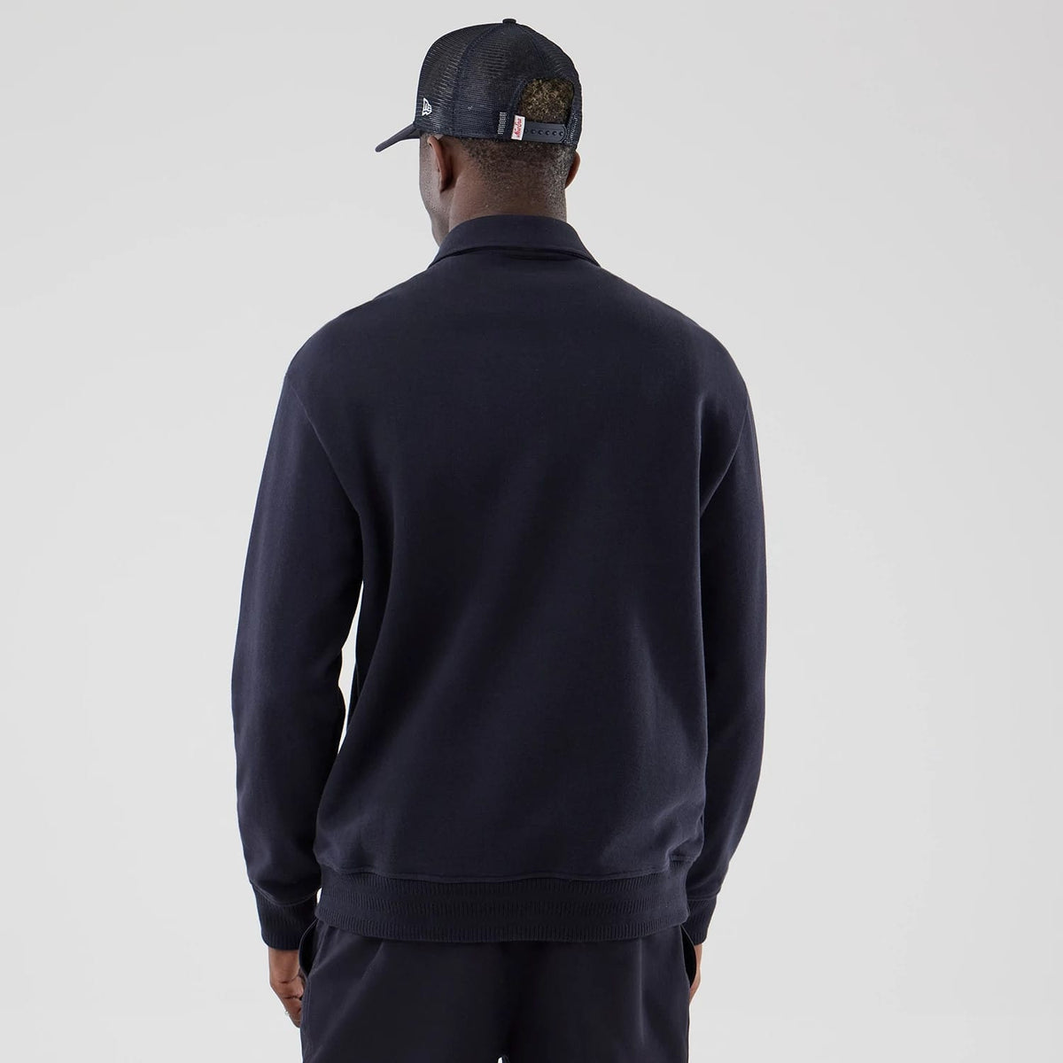 The model is wearing this MLB LA Dodgers Oversized 1/4 Zip Sweater in navy. 2