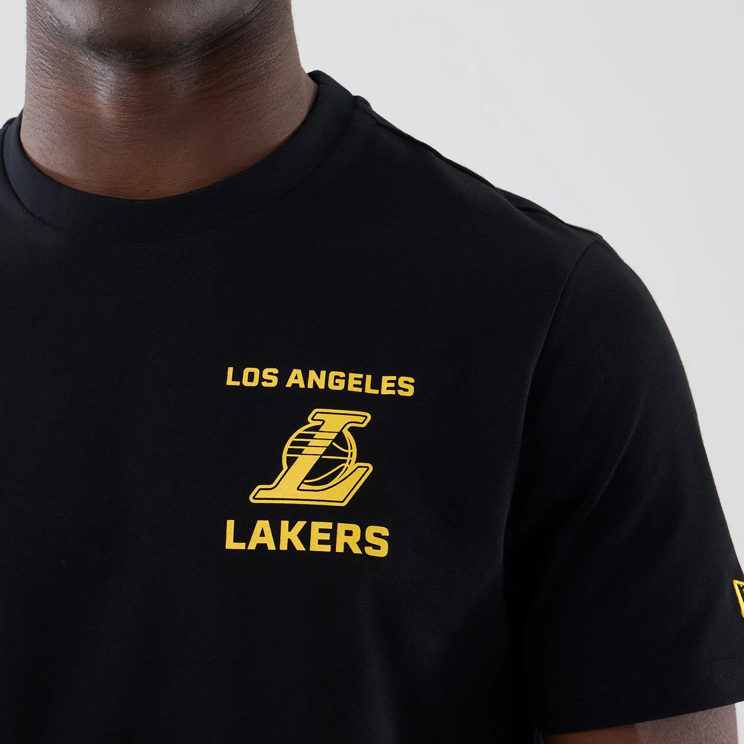 The model is wearing this NBA Court Graphic LA Lakers T-Shirt in black. 5
