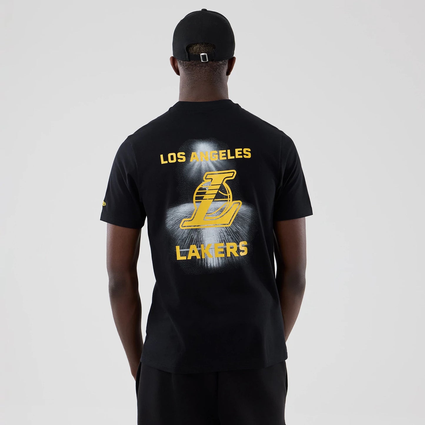 The model is wearing this NBA Court Graphic LA Lakers T-Shirt in black. 2