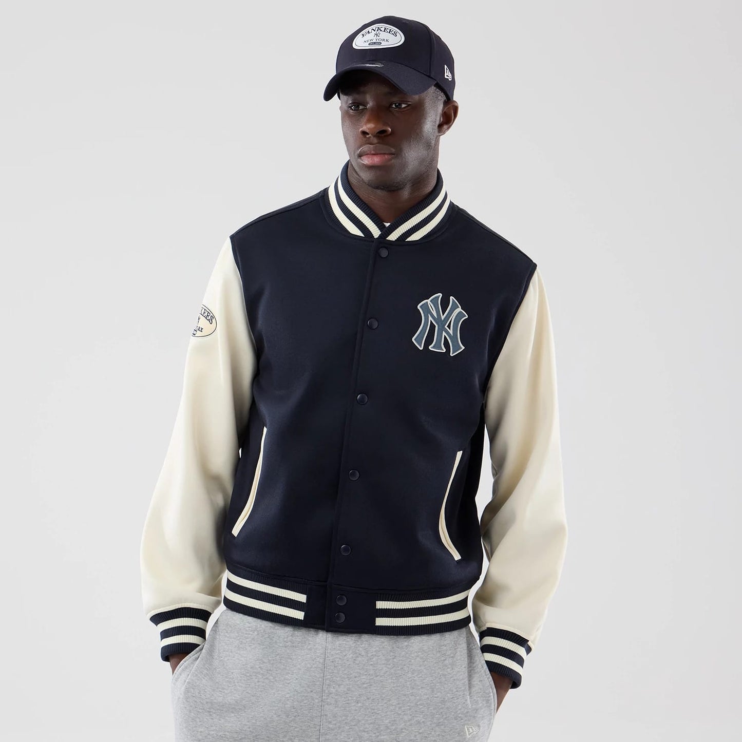 The model is wearing this MLB Jersey Bomber New York Yankees Jacket in navy. 3