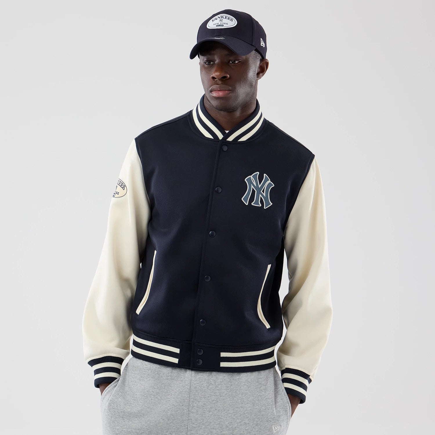 The model is wearing this MLB Jersey Bomber New York Yankees Jacket in navy. 3