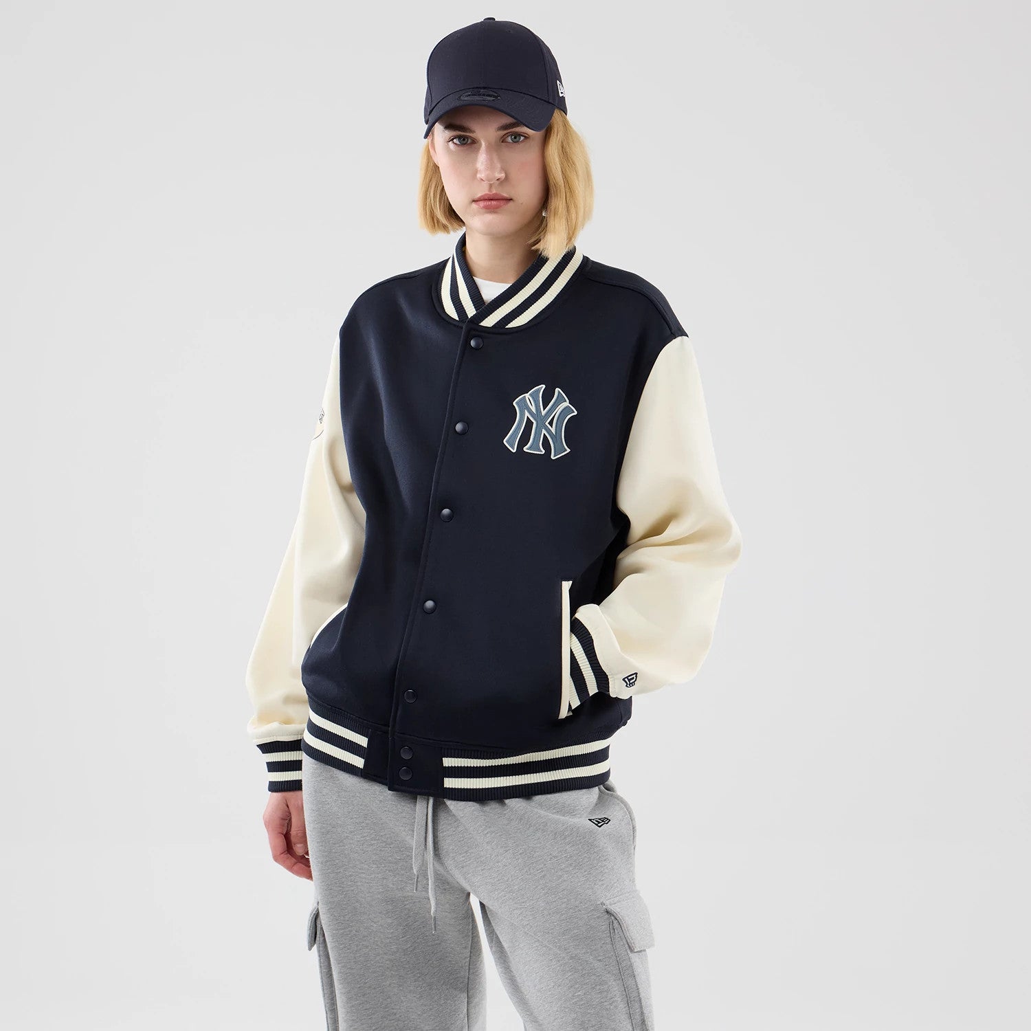 The model is wearing this MLB Jersey Bomber New York Yankees Jacket in navy. 4