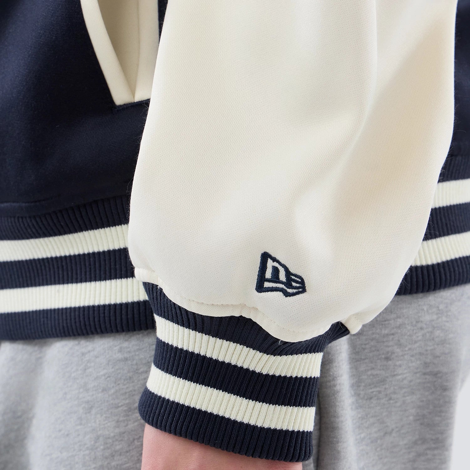 The model is wearing this MLB Jersey Bomber New York Yankees Jacket in navy. 7