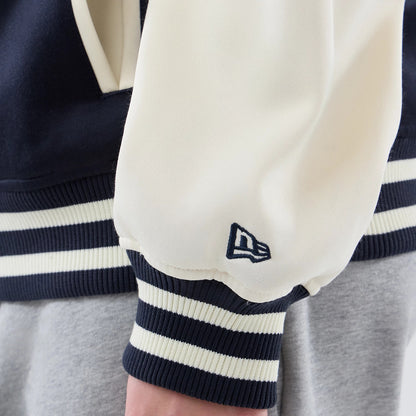 The model is wearing this MLB Jersey Bomber New York Yankees Jacket in navy. 7