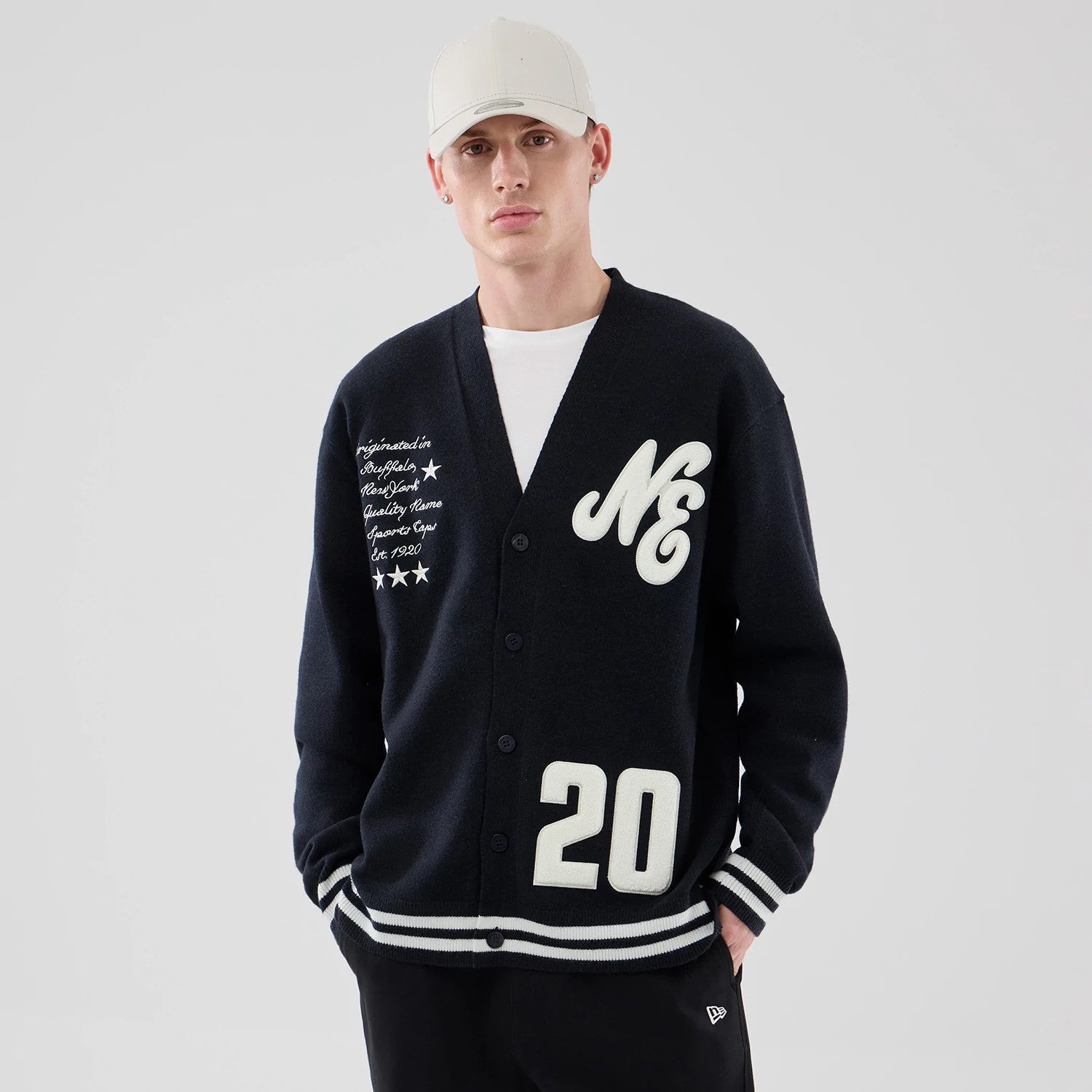 The model is wearing this New Era Heritage Cardigan in navy. 3