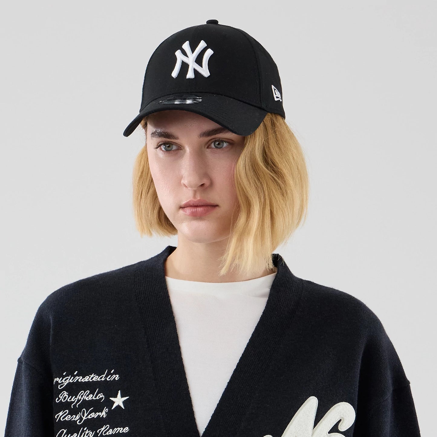 The model is wearing this New Era Heritage Cardigan in navy. 6