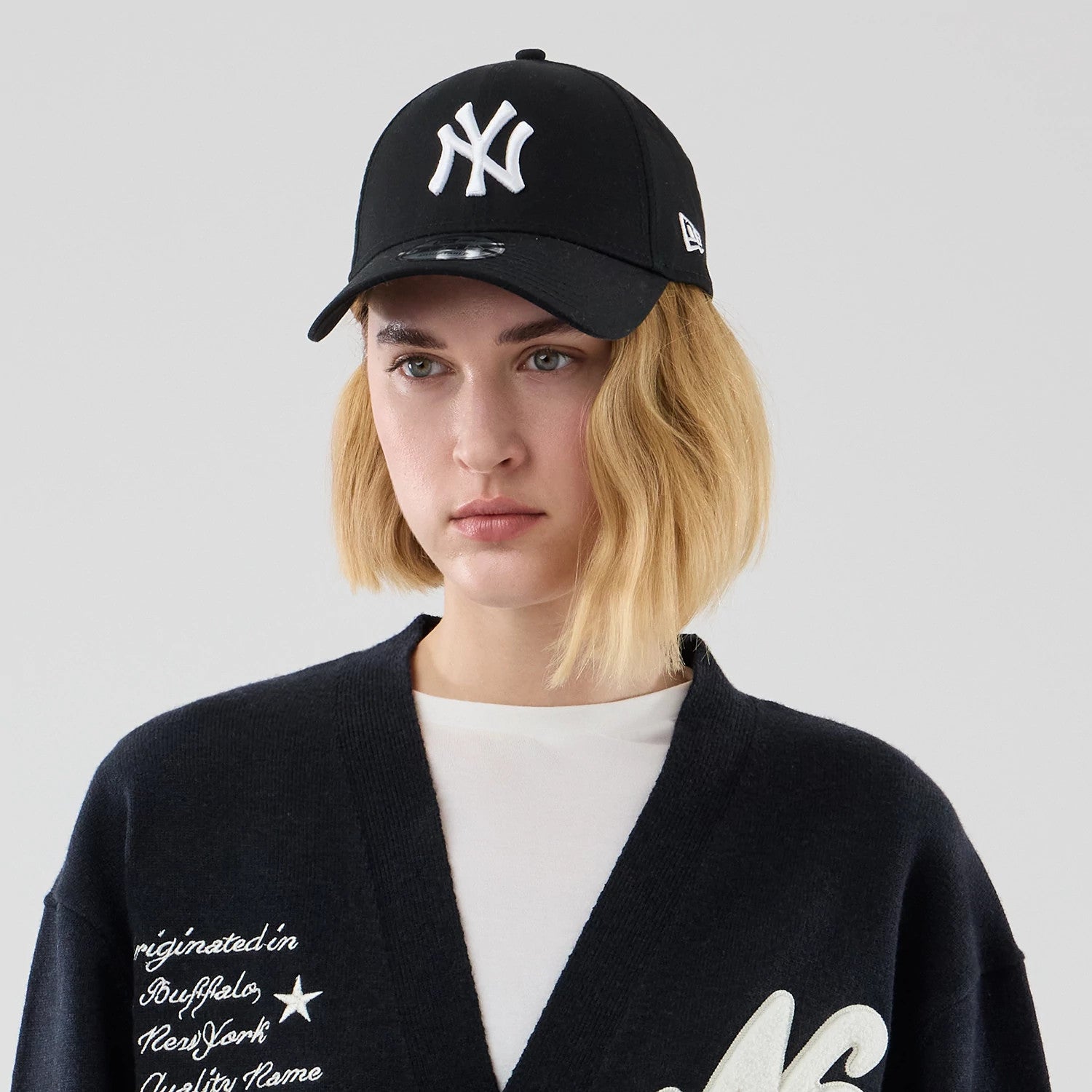 The model is wearing this New Era Heritage Cardigan in navy. 6
