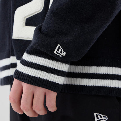 The model is wearing this New Era Heritage Cardigan in navy. 7