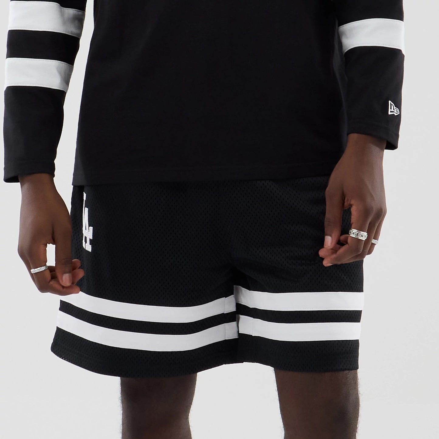 The model is wearing these MLB Mesh LA Dodgers Oversized Shorts in black. 6