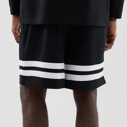 The model is wearing these MLB Mesh LA Dodgers Oversized Shorts in black. 7