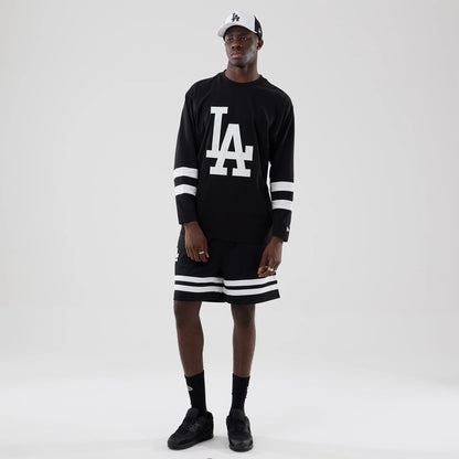 The model is wearing these MLB Mesh LA Dodgers Oversized Shorts in black. 8