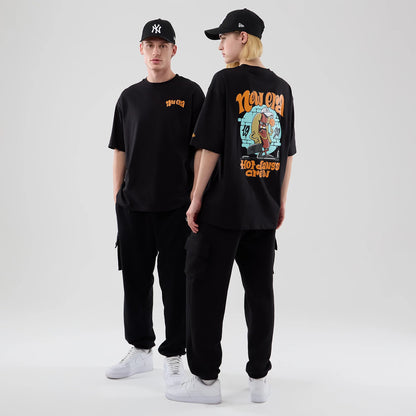 The model is wearing this New Era Hot Dog Graphic Oversized T-Shirt in black. 1