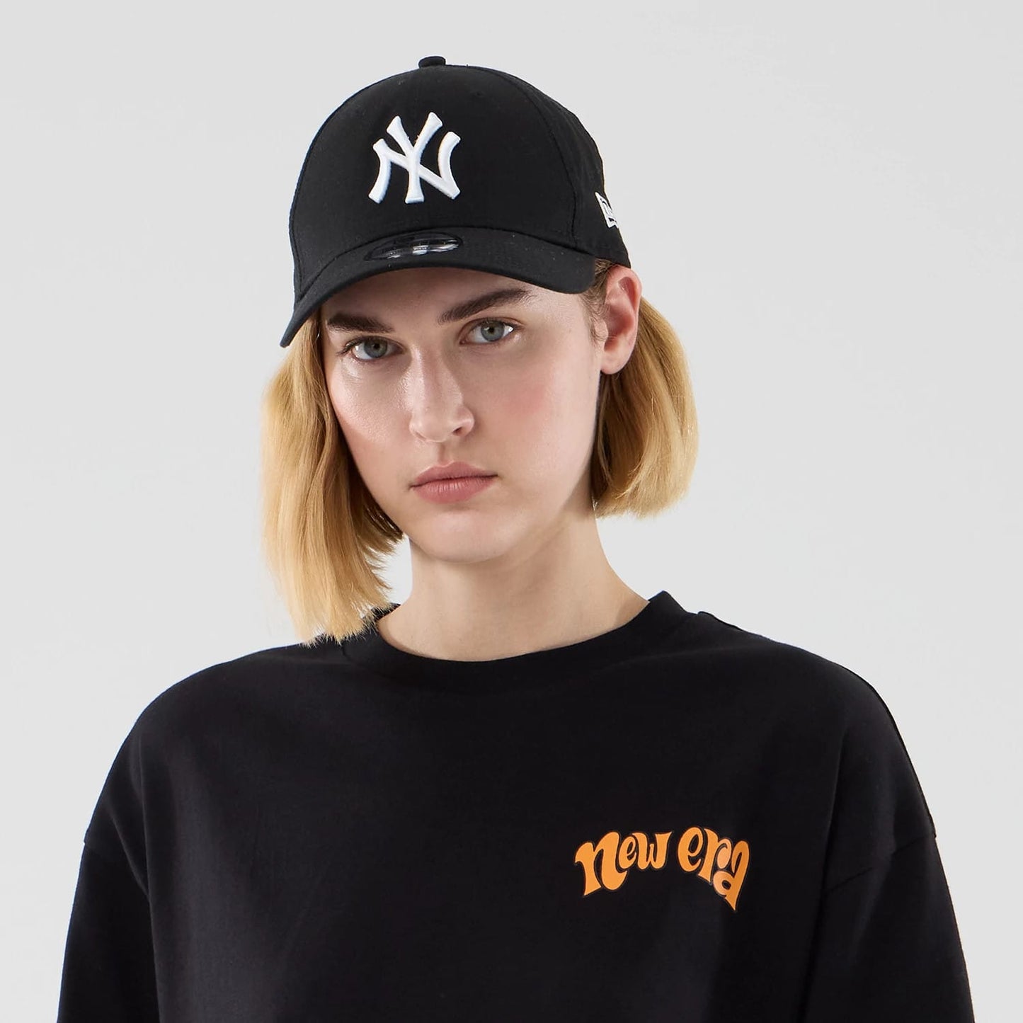 The model is wearing this New Era Food Graphic Oversized T-Shirt in black. 6