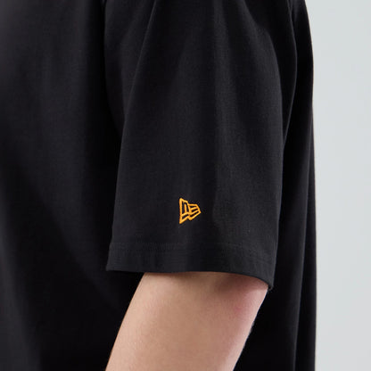 The model is wearing this New Era Hot Dog Graphic Oversized T-Shirt in black. 7