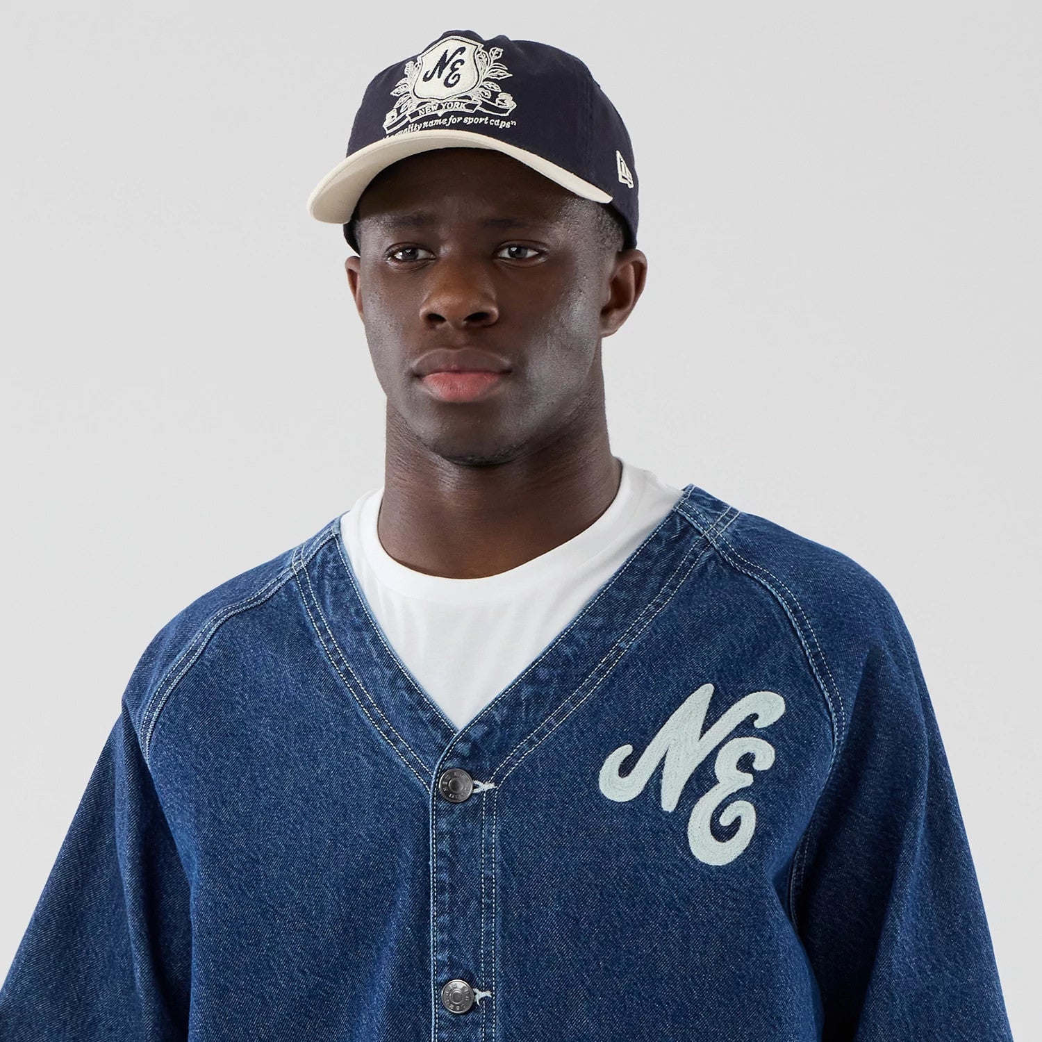 The model is wearing this New Era Denim Worker Jacket in dark blue. 6