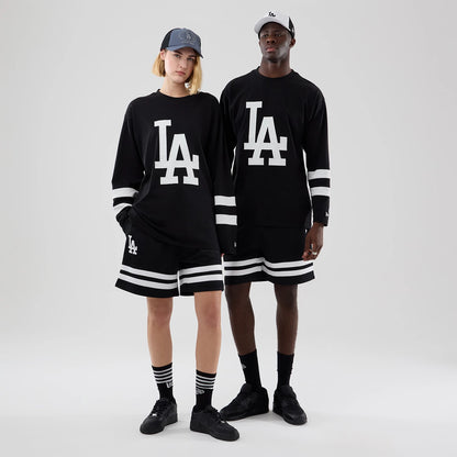 The model is wearing this MLB LA Dodgers Oversized Long Sleeve T-Shirt in black. 1