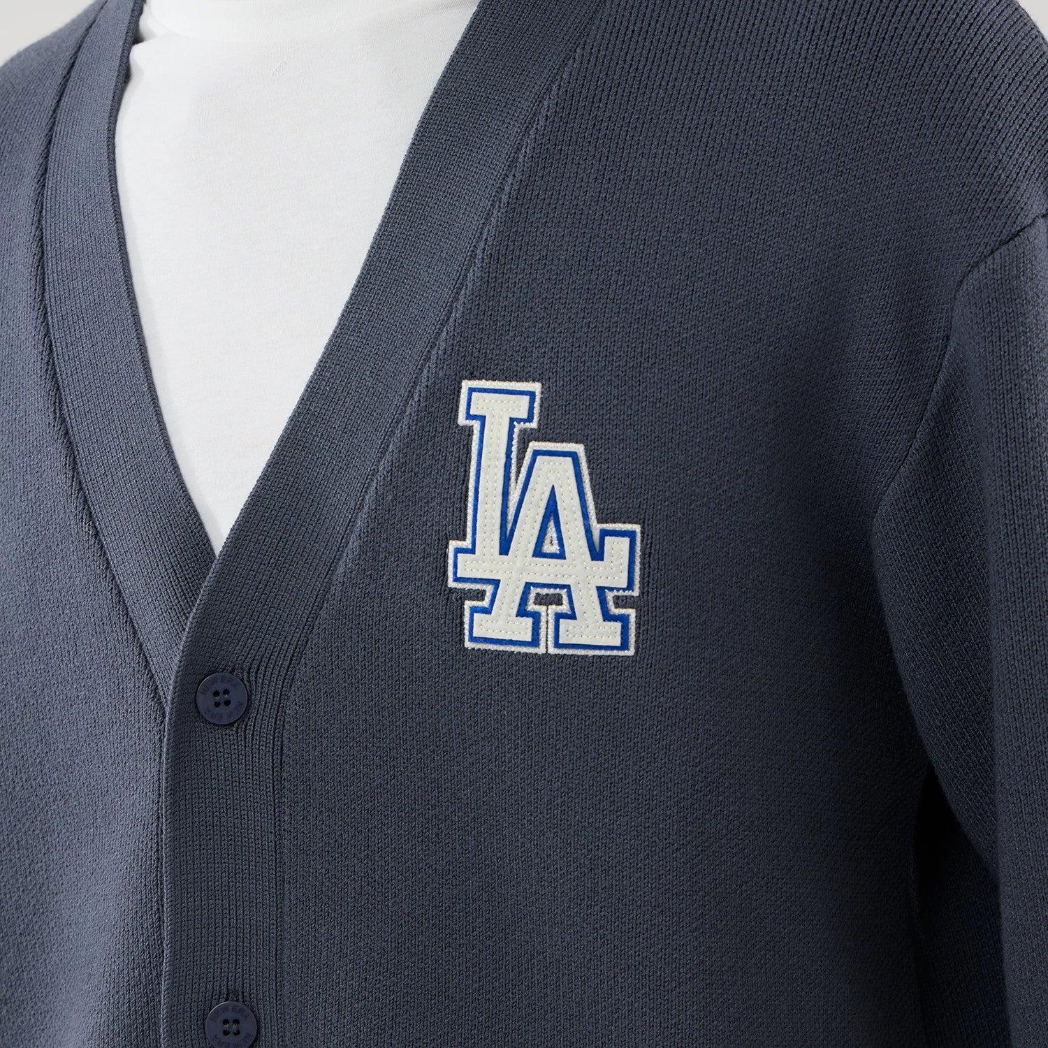 The model is wearing this MLB Knit LA Dodgers Cardigan in grey. 4