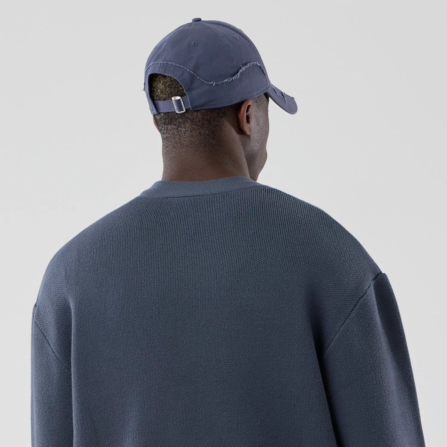 The model is wearing this MLB Knit LA Dodgers Cardigan in grey. 7