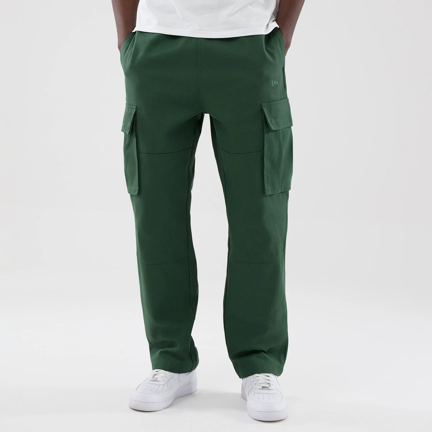 The model is wearing these New Era Cargo Trousers in dark green. 1