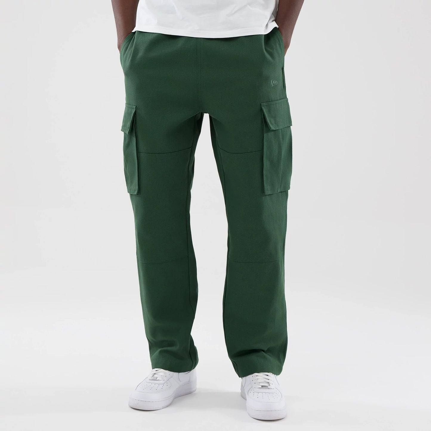 The model is wearing these New Era Cargo Trousers in dark green. 1