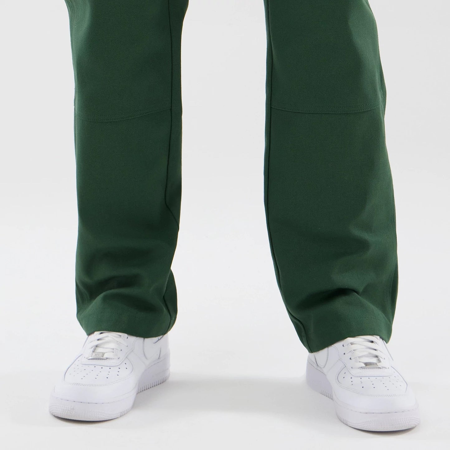The model is wearing these New Era Cargo Trousers in dark green. 6