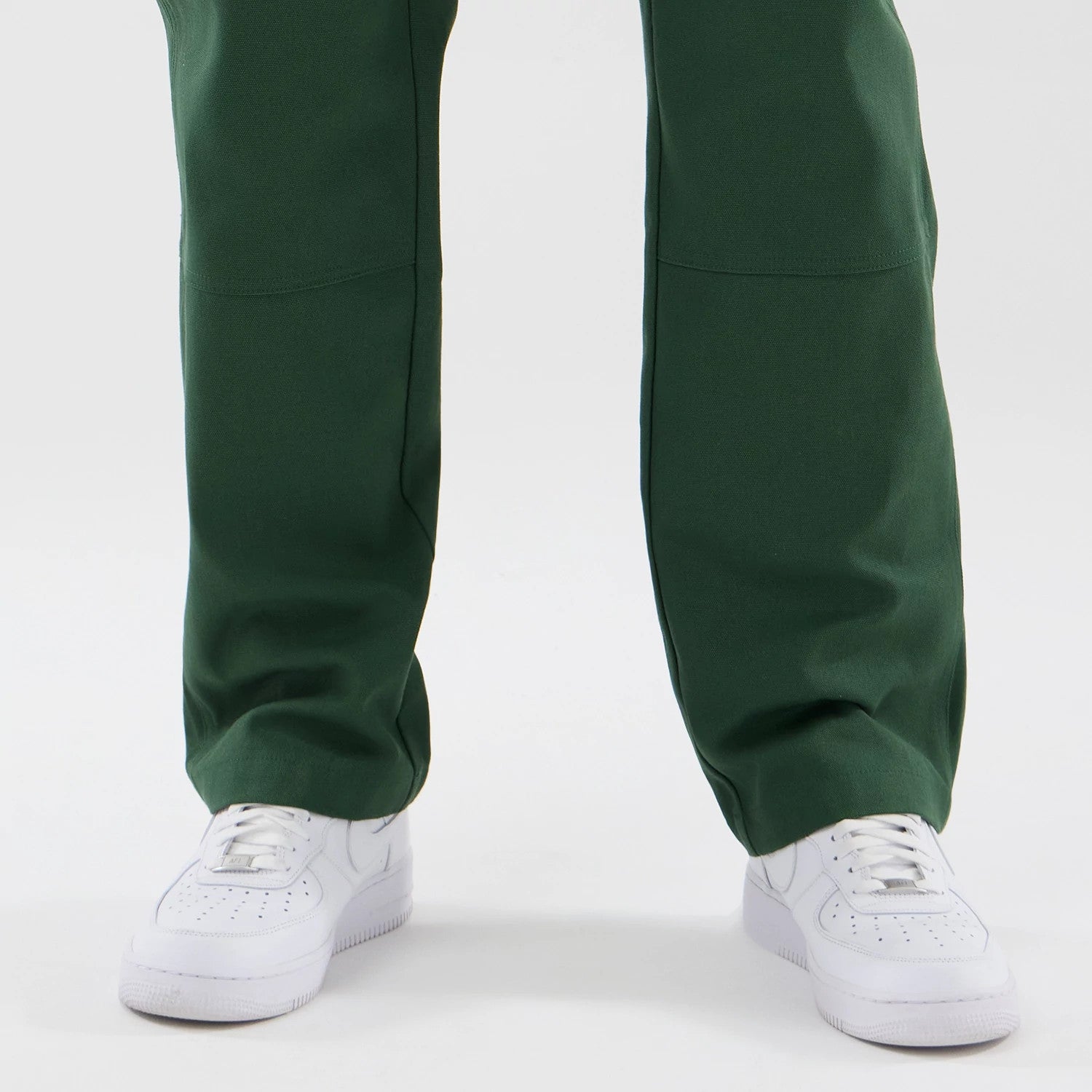 The model is wearing these New Era Cargo Trousers in dark green. 6