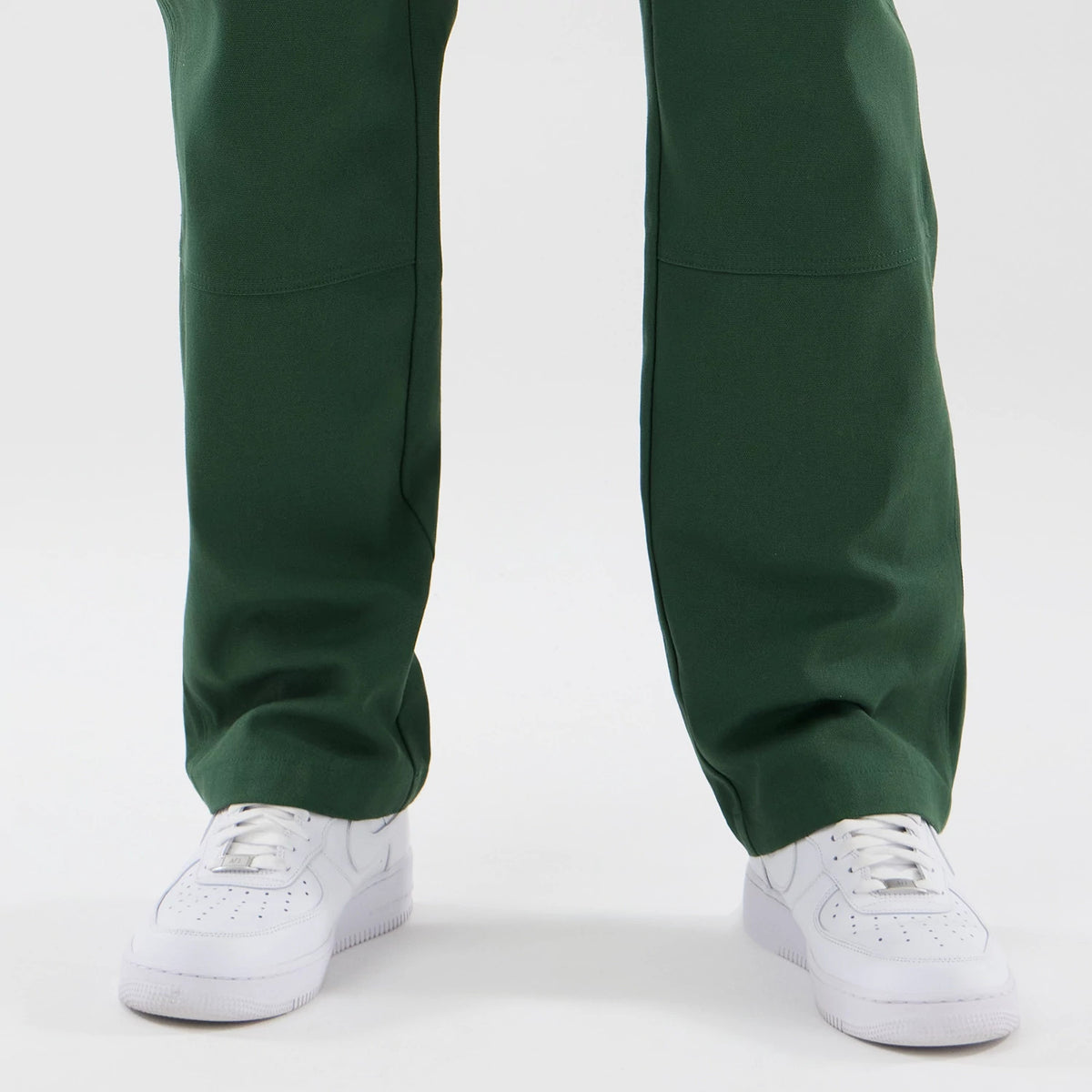 The model is wearing these New Era Cargo Trousers in dark green. 6
