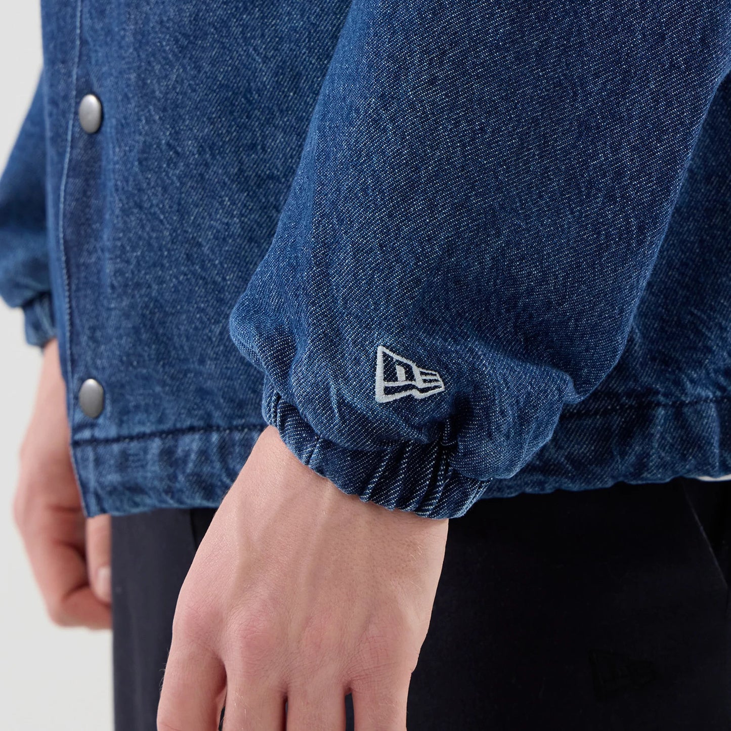 The model is wearing this MLB Coaches LA Dodgers Jacket in dark blue. 5