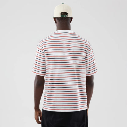 The model is wearing this New Era Stripe Oversized T-Shirt in white. 2