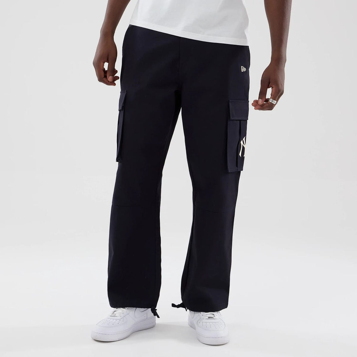 The model is wearing these MLB New York Yankees Cargo Trousers in navy. 3