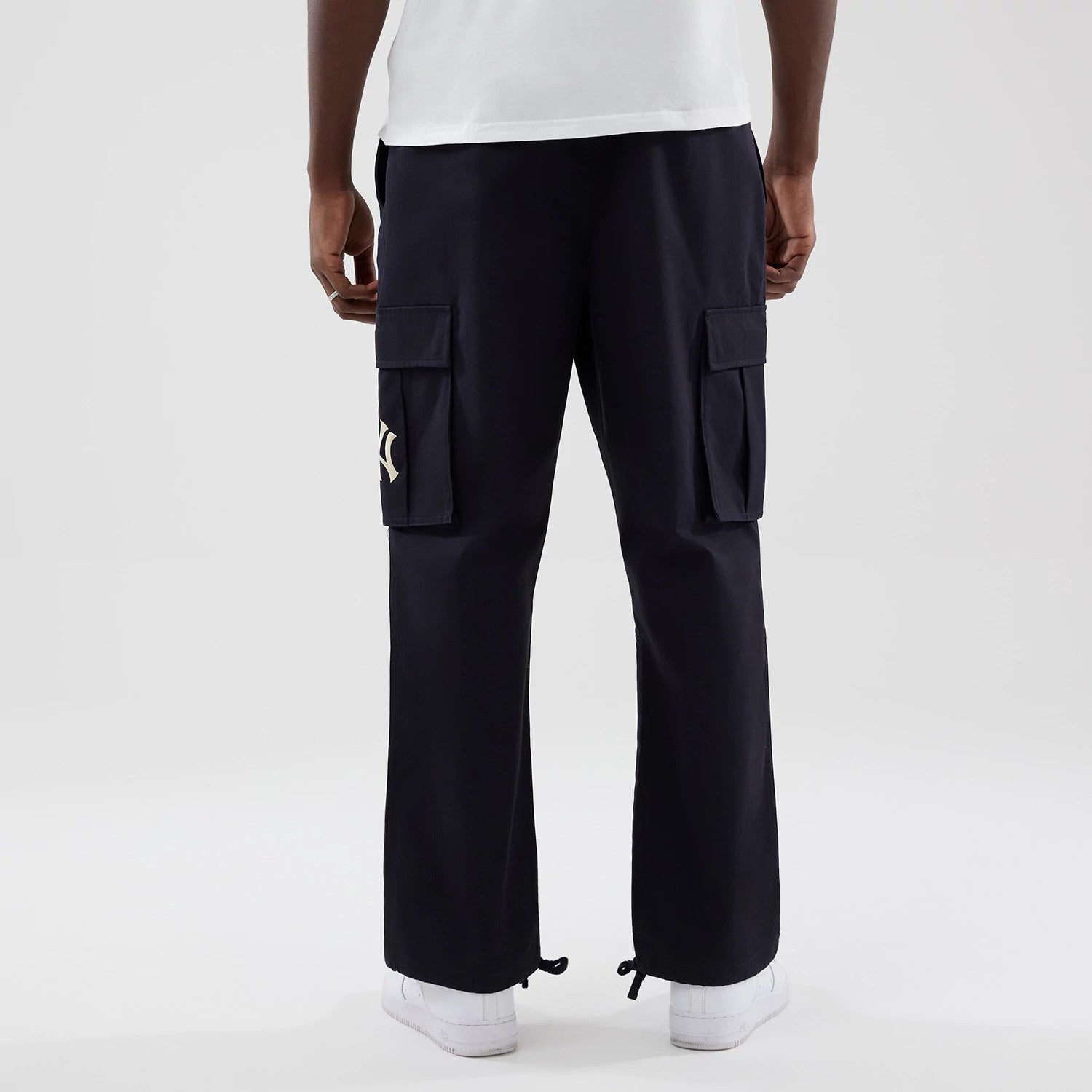The model is wearing these MLB New York Yankees Cargo Trousers in navy. 2