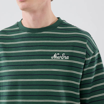 The model is wearing this New Era Stripe Oversized T-Shirt in dark green. 5