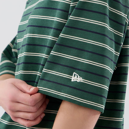 The model is wearing this New Era Stripe Oversized T-Shirt in dark green. 7