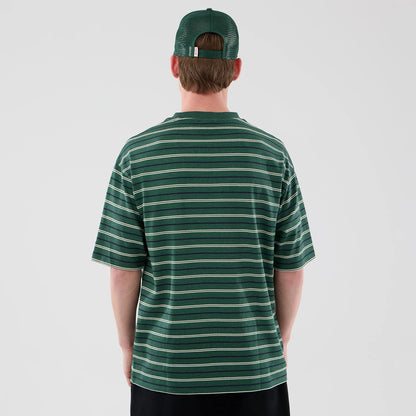 The model is wearing this New Era Stripe Oversized T-Shirt in dark green. 2