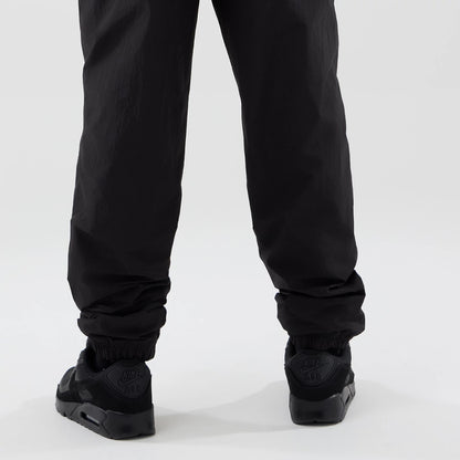 The model is wearing these MLB Piping Track LA Dodgers Track Pants in black. 4