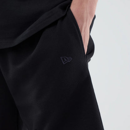 The model is wearing these NBA League Essential Chicago Bulls Oversized Shorts in black. 5