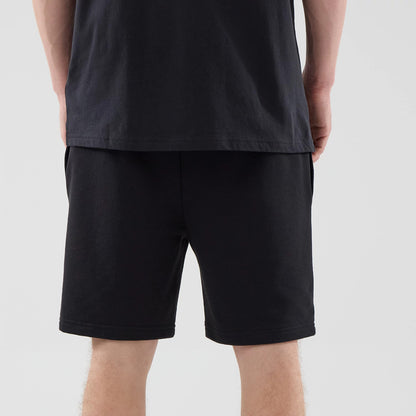 The model is wearing these NBA League Essential Chicago Bulls Oversized Shorts in black. 7