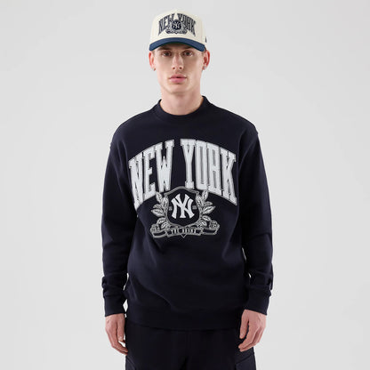 New Era New York Yankees MLB Arch Graphic Navy Oversized Crew Neck Sweater, front view on a model with a matching cap, featuring large white New York text and a central Yankees logo with laurel details on the chest.