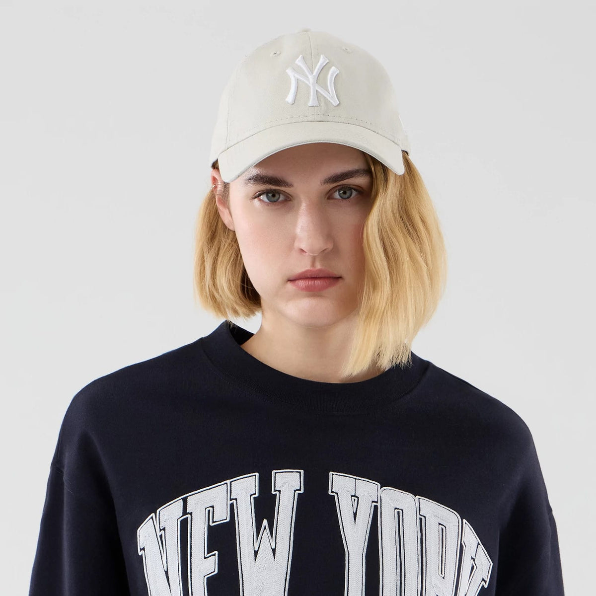 The model is wearing this MLB Arch Graphic New York Yankees Oversized Crew Neck Sweater in navy. 6