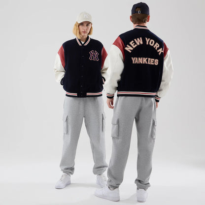 The model is wearing this MLB Varsity New York Yankees Jacket in navy. 1