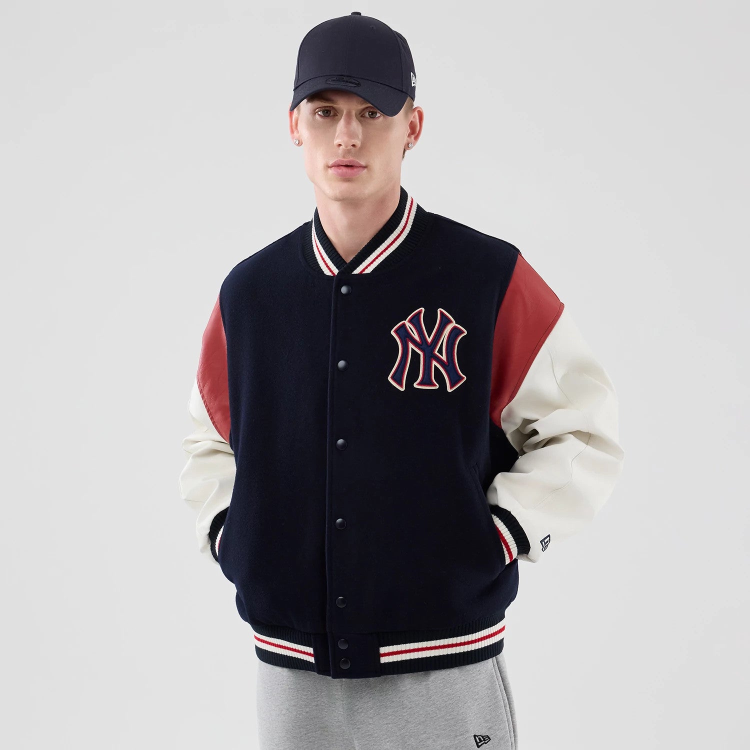 The model is wearing this MLB Varsity New York Yankees Jacket in navy. 3