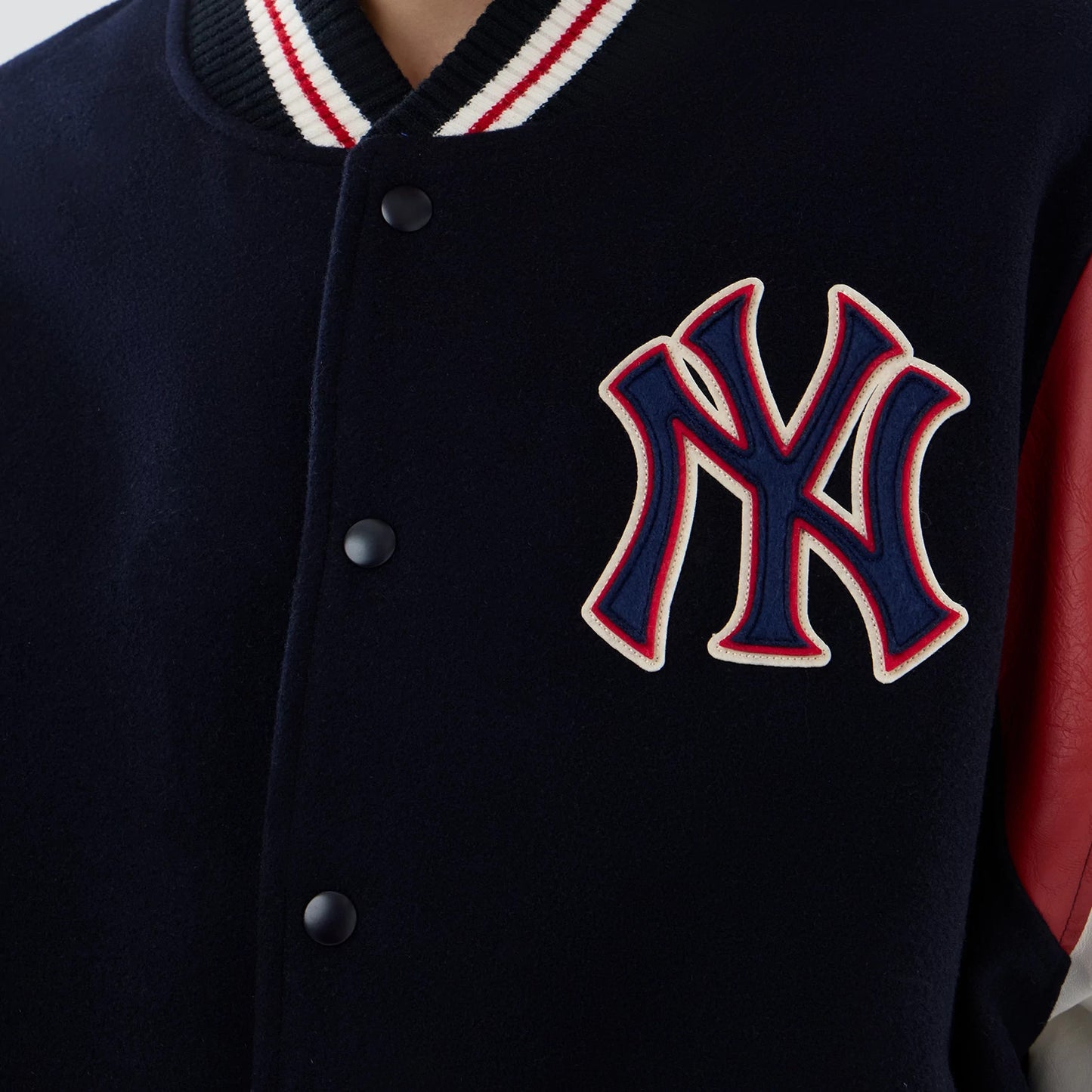 The model is wearing this MLB Varsity New York Yankees Jacket in navy. 6